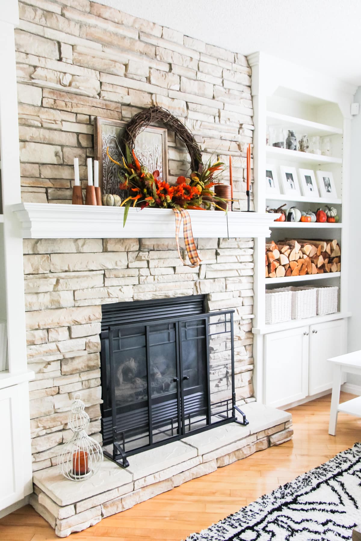 Adorable fall wreath on a fireplace mantel.