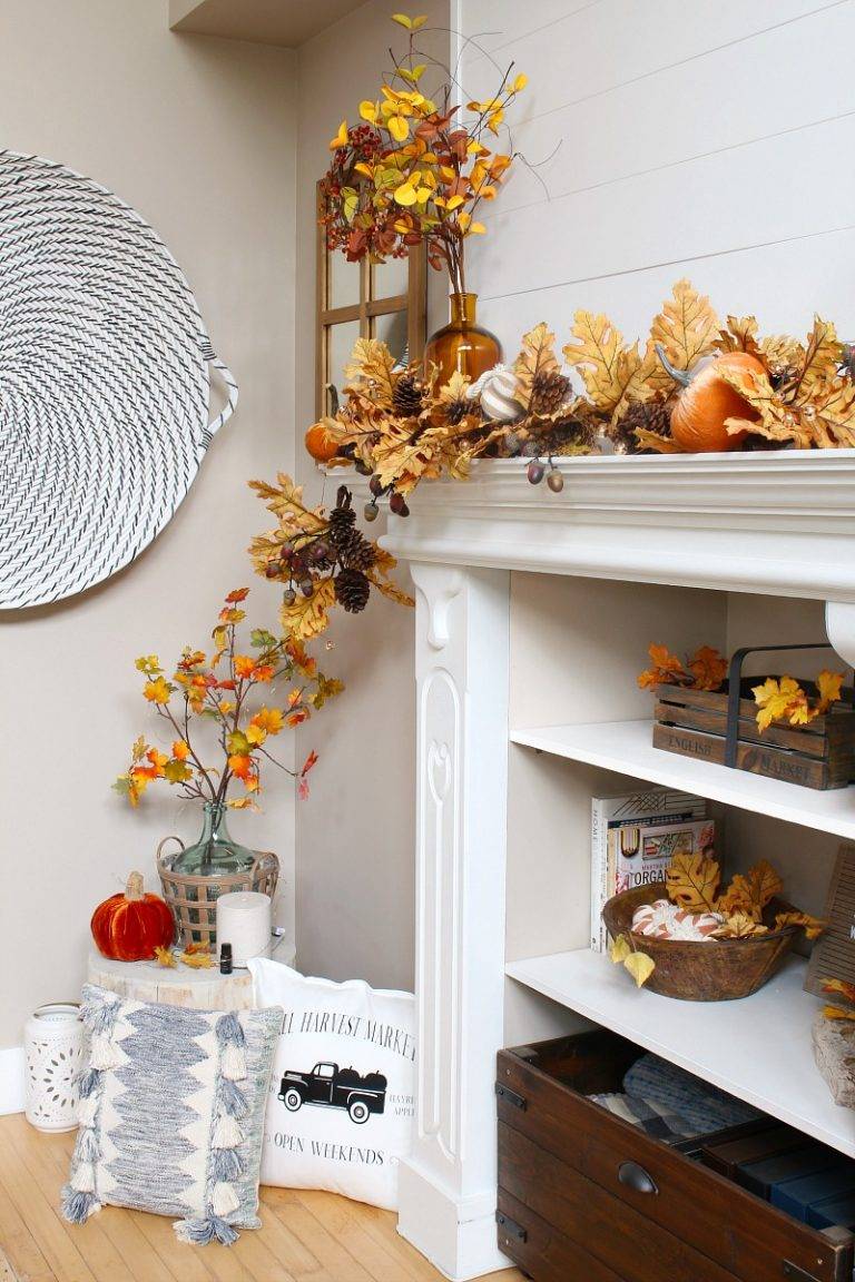 Fall themed fireplace mantel with fall decor.