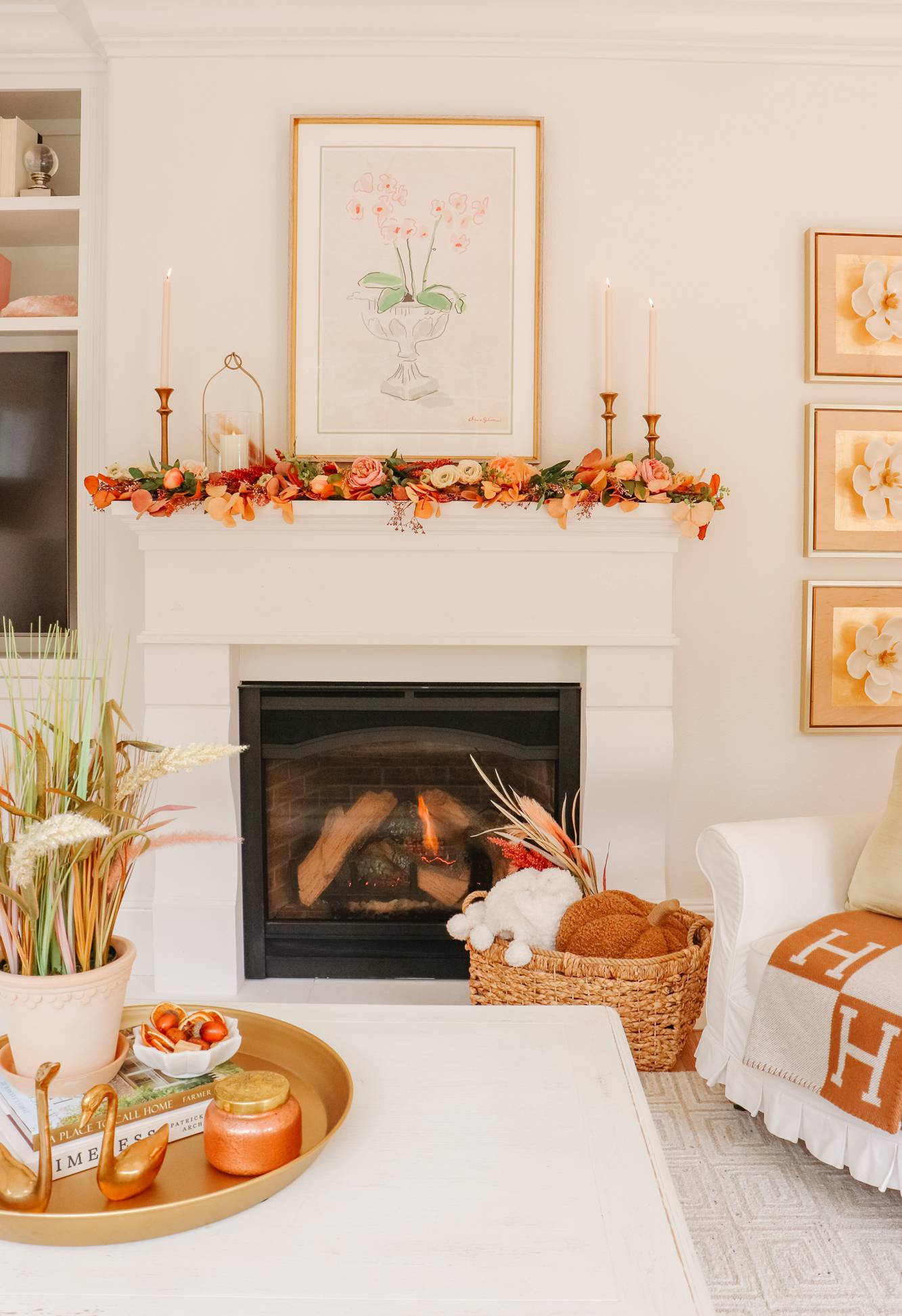 Orange and brass fireplace mantel decor.