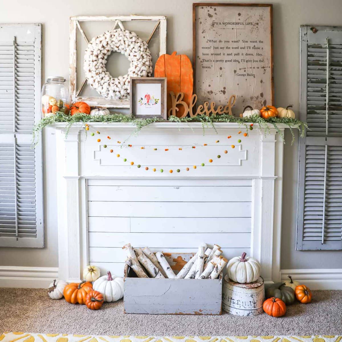 Rustic fall mantel with enclosed fireplace.