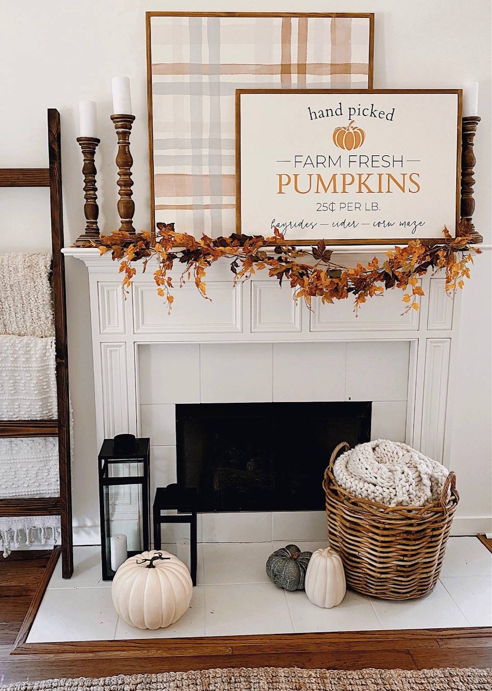 Modern farmhouse fireplace mantel with fall-themed sign.