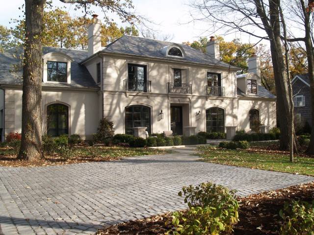 Beautiful two-story home design with juliet balconies.