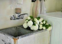 antique distressed wash sink with flowers white hydrangeas vintage laundry room country chic style