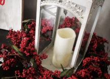 red berry wreath around a white lantern