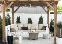 pergola light wood white backyard fence outdoor sectional seating area concrete patio