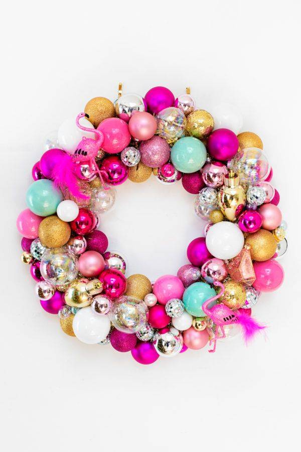 pink and silver bauble christmas wreath on white background