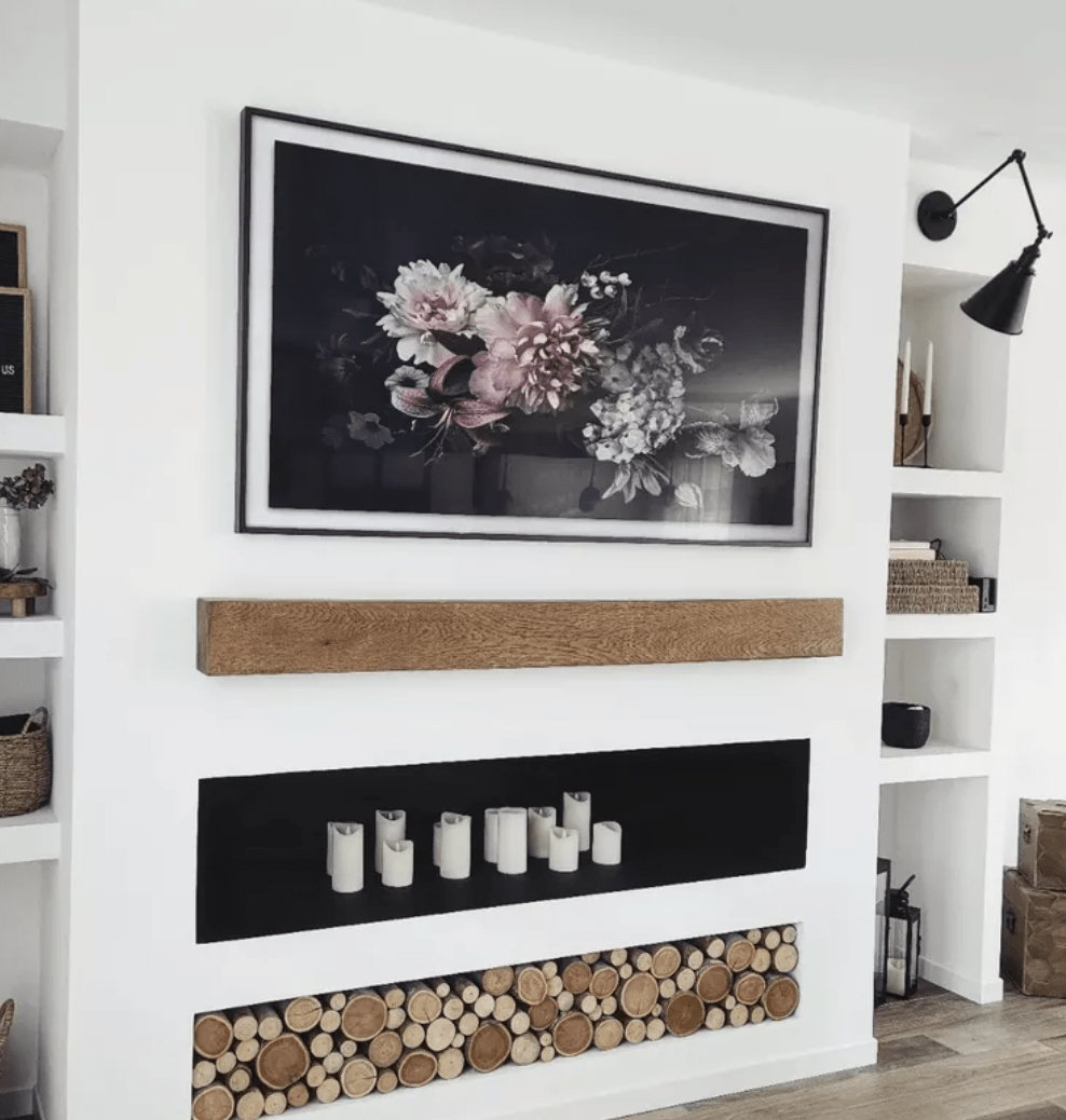 contemporary fireplace with modern samsung frame tv wood mantle and wood log rounds