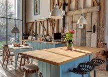 country barn kitchen with exposed beams island tractor seat stools hanging pendants