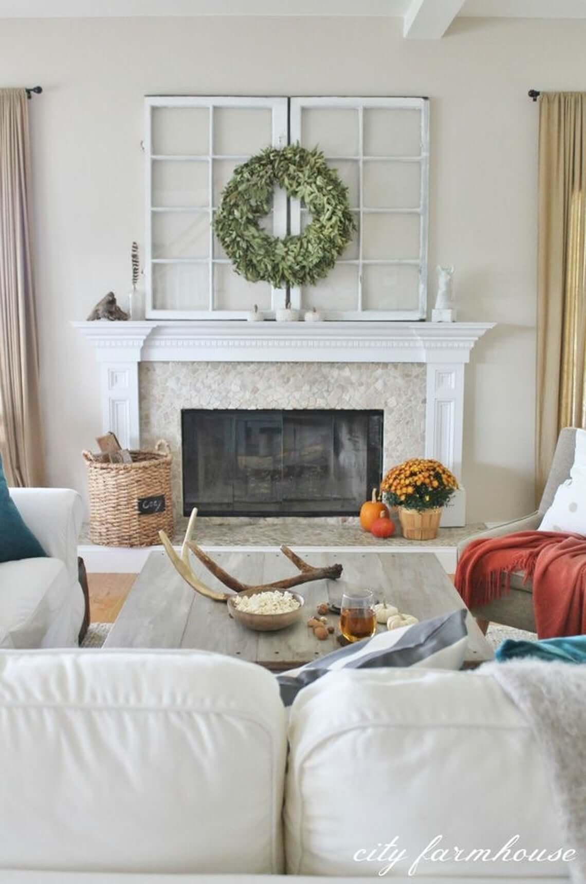 white living room city farmhouse with framed windows above mantle on fireplace white couches country chic style