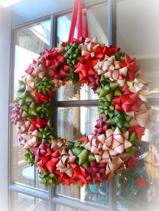 gift bow wreath hanging on front door