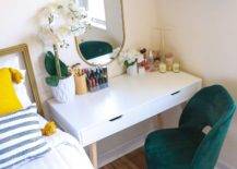 white desk in front of green chair