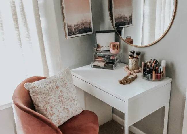 white desk in front of a pink chair