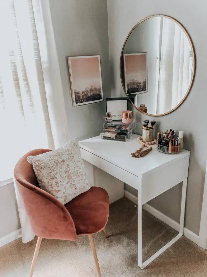 white desk in front of a pink chair