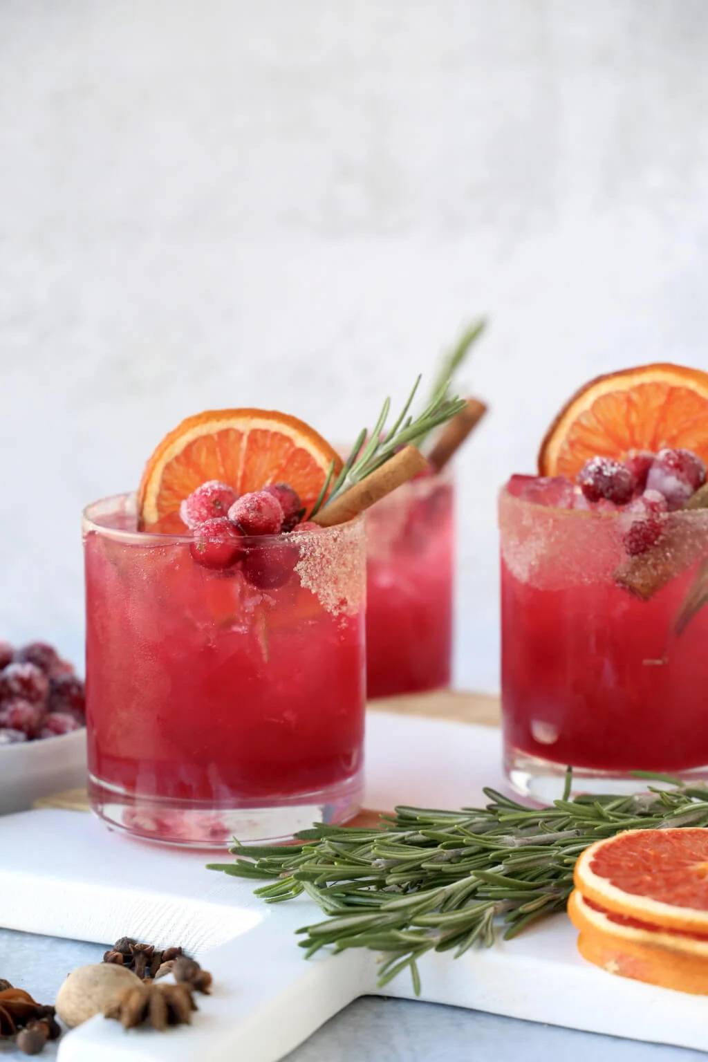 red cocktail with rosemary sprigs