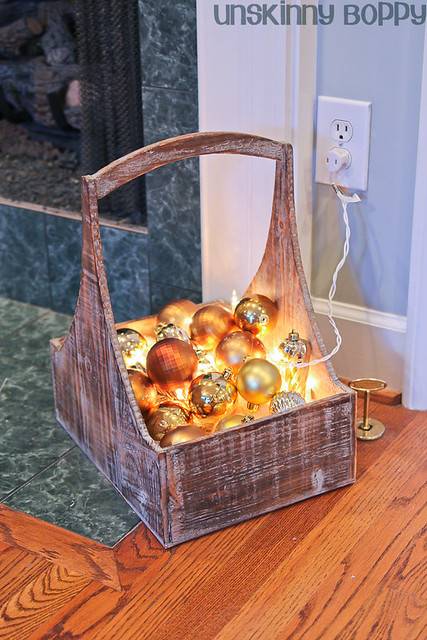 ornaments and christmas lights in a basket