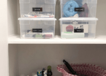 plastic storage containers in linen closet weaved basket on shelf