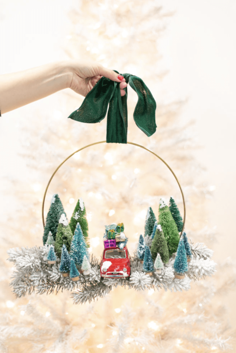vintage wreath with toy cars and bottle brush trees