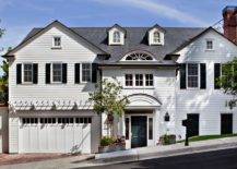 Lovely pale gray colonial home with two car attached garage.