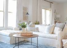 cozy-winter-home-tour-tips-boho-chic-living-room-blue-vintage-inspired-rug-white-linen-couch-brass-coffee-table-white-curtains-brass-rods-3-33890-217x155