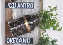 Mounted mason jars herb containers on rustic wood