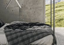 Modern concrete bedroom with terrazzo flooring