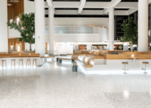 terrazzo floor in large open atrium space with bar and stools