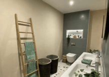 terrazzo floor in bathroom with towel ladder double vanity