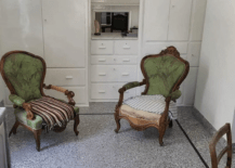 terrazzo floor in sitting room with two antique chairs