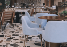 terrazzo floor large stone pattern in resteraunt blue chairs cafe