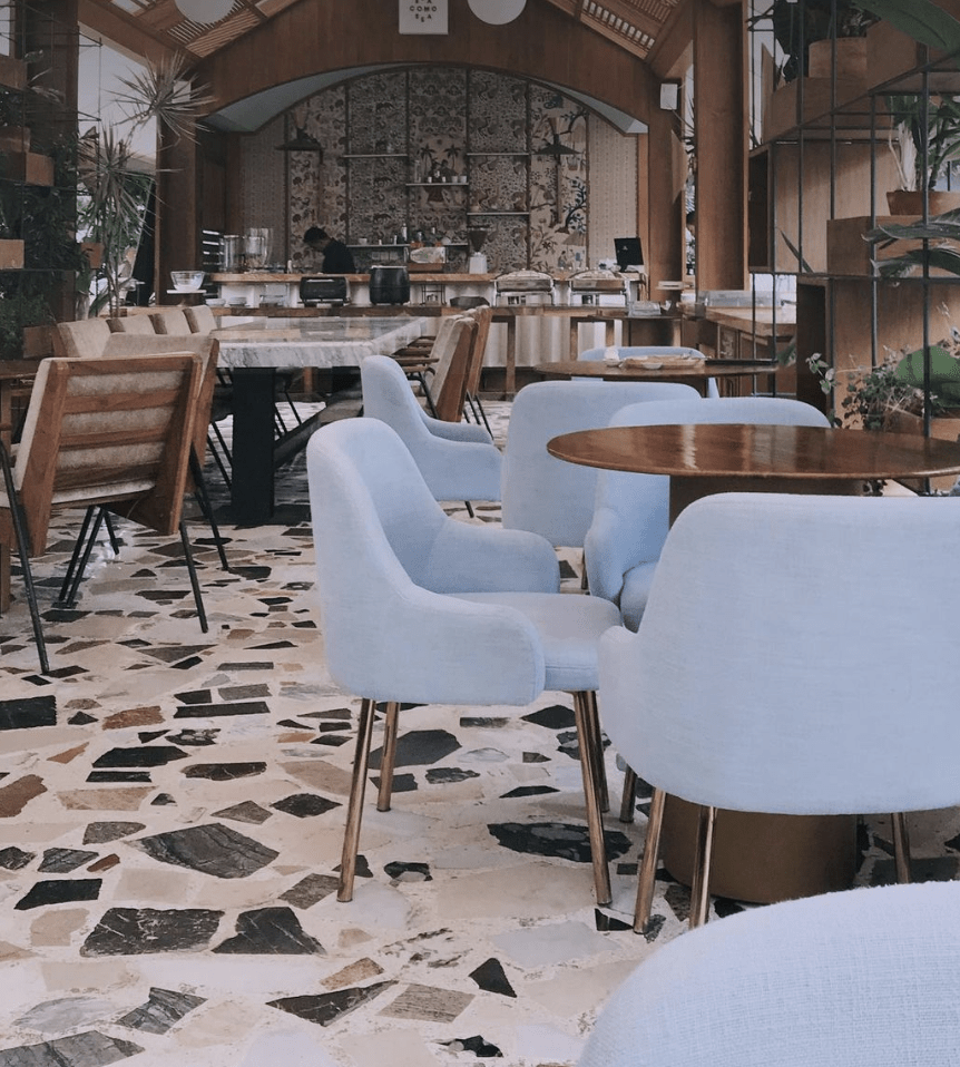terrazzo floor large stone pattern in resteraunt blue chairs cafe