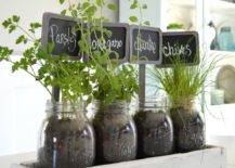 table top herb garden with mason jars old wood pallet box and chalkboard signs