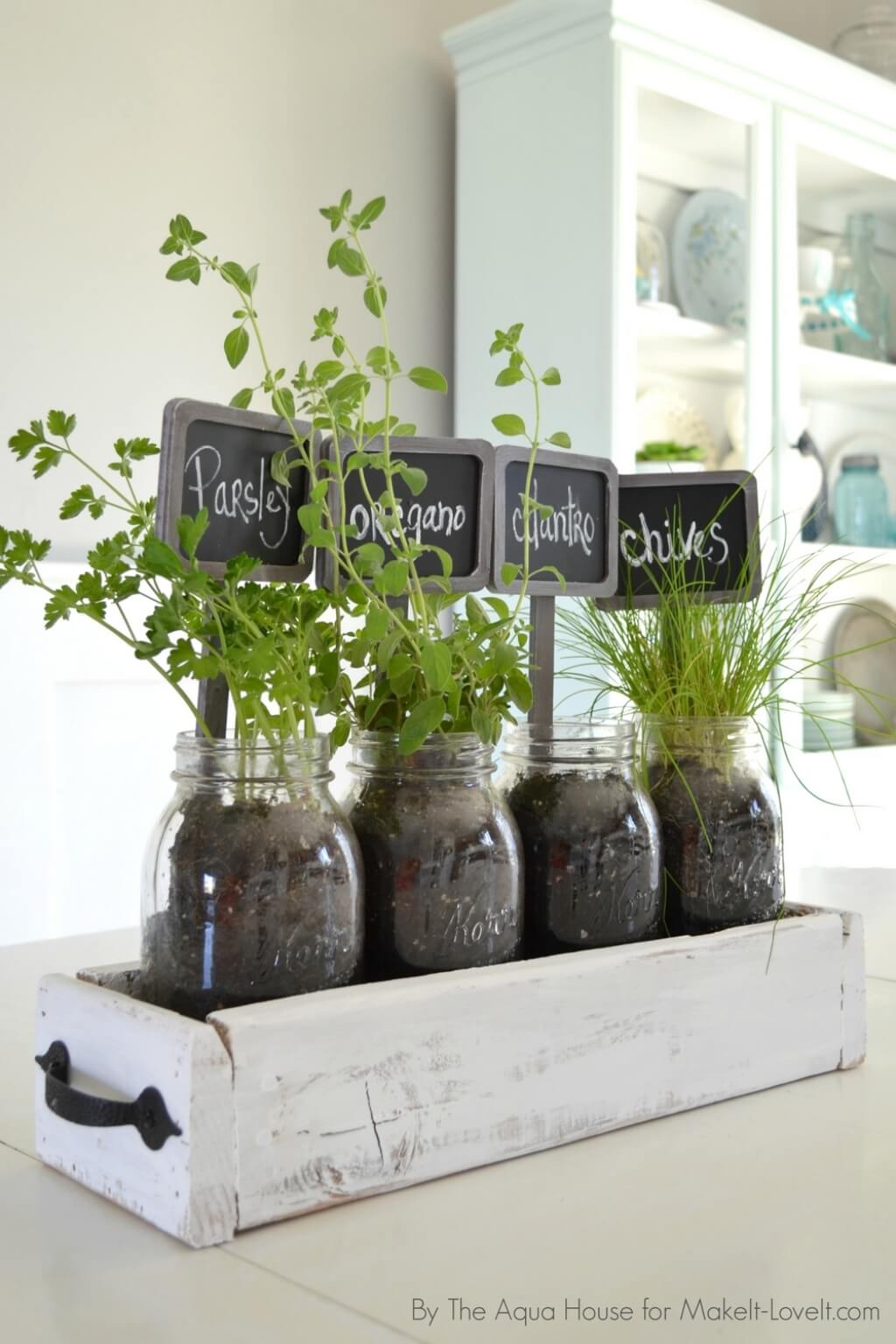 table top herb garden with mason jars old wood pallet box and chalkboard signs