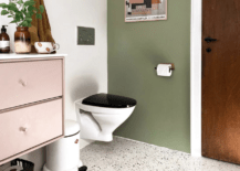 terrazzo floor in bathroom with floating toilet green and pink color scheme