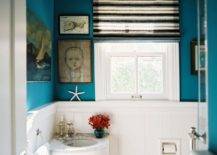 Blue Wall painted bathroom with corner vanity.