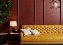 burgundy wall with mustard yellow leather couch