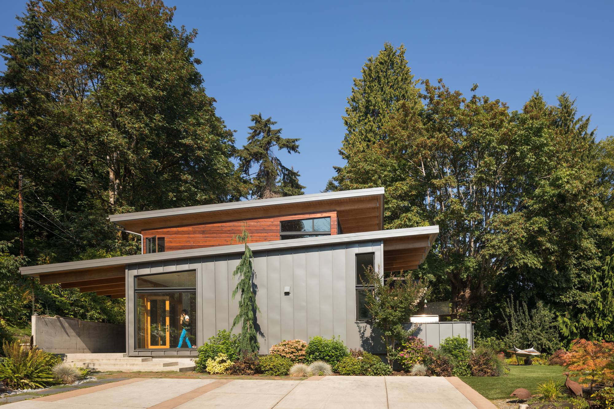 dark metal siding on two story angular wooden cabin