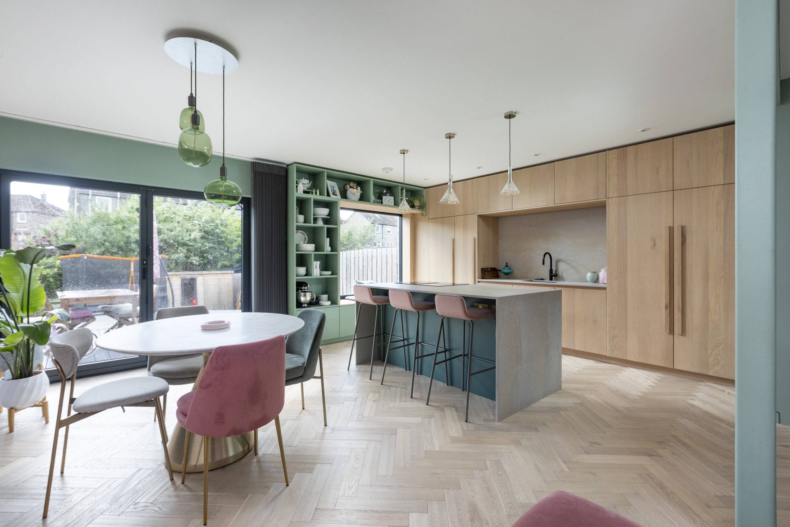 pink and green color palette in midcentury dining room kitchen area