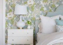 Bedroom features a white rippled gourd lamp on a white geometric nightstand and a Heather gray bed on green and yellow botanical wallpaper.