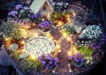 light up magical fairy garden with stones and tiny houses