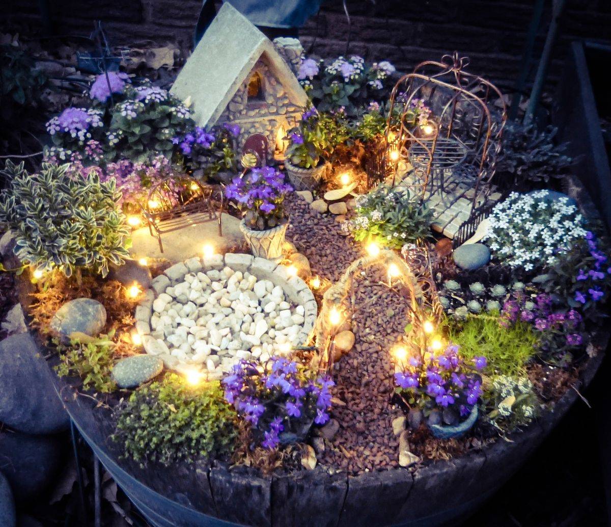 light up magical fairy garden with stones and tiny houses