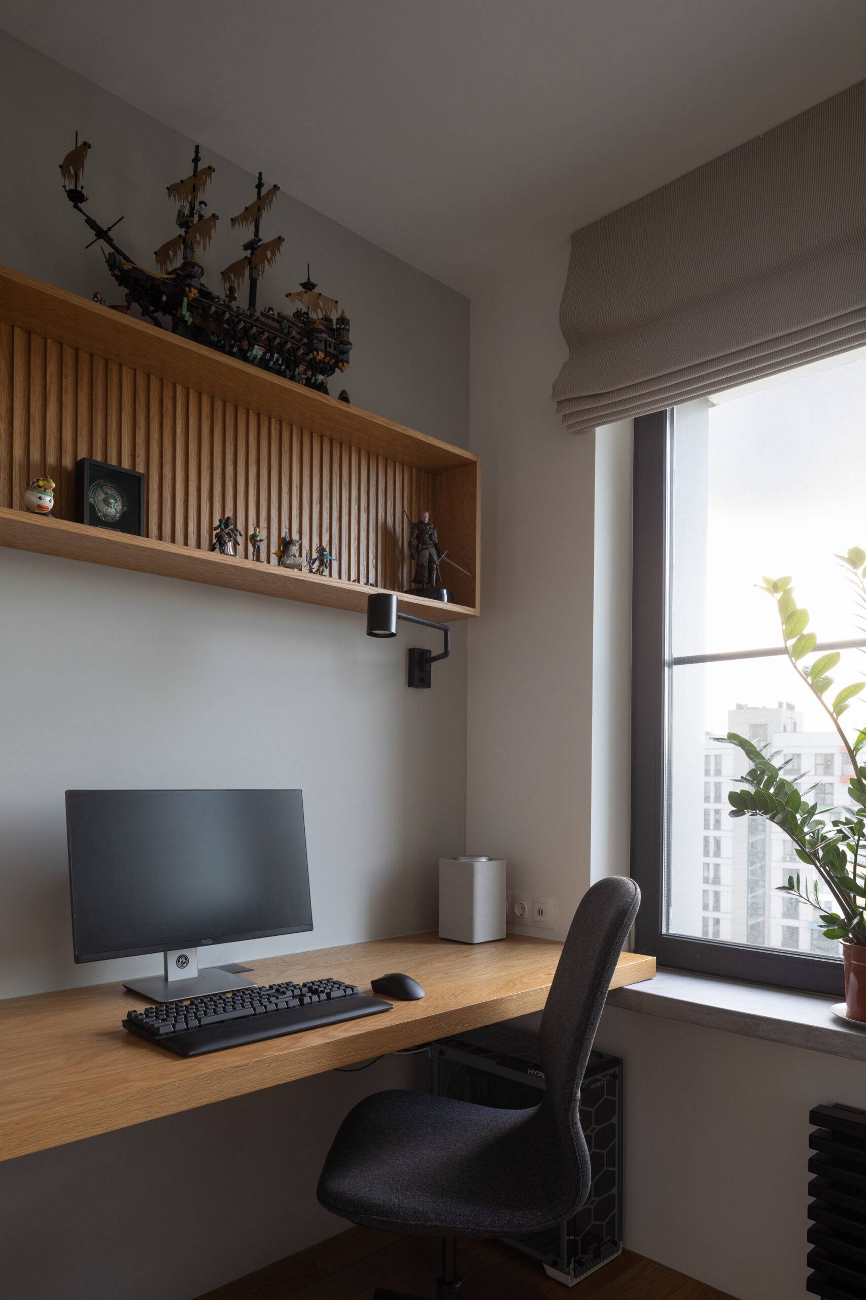 minimal study room with wood slab desk and dark accessories