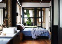 dark walls studio apartment with ben countertop sink walnut wood floors