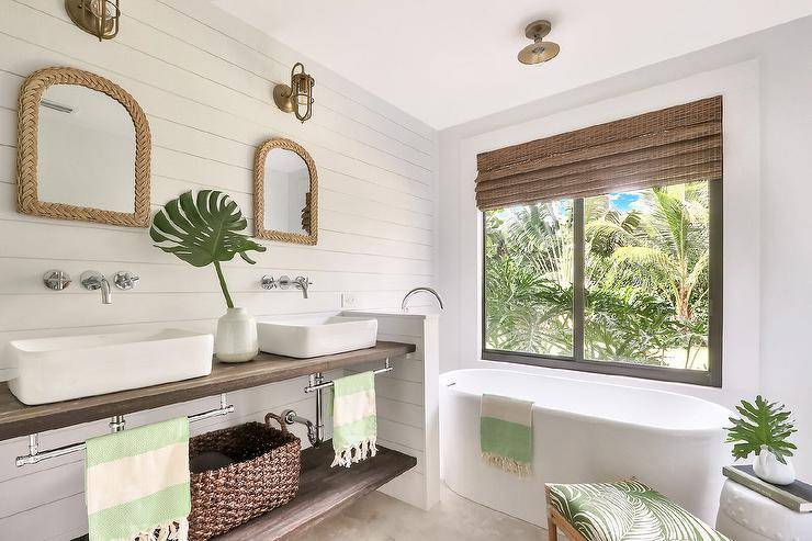 Spa-like white master bath with warm wood accents and tropical greenery