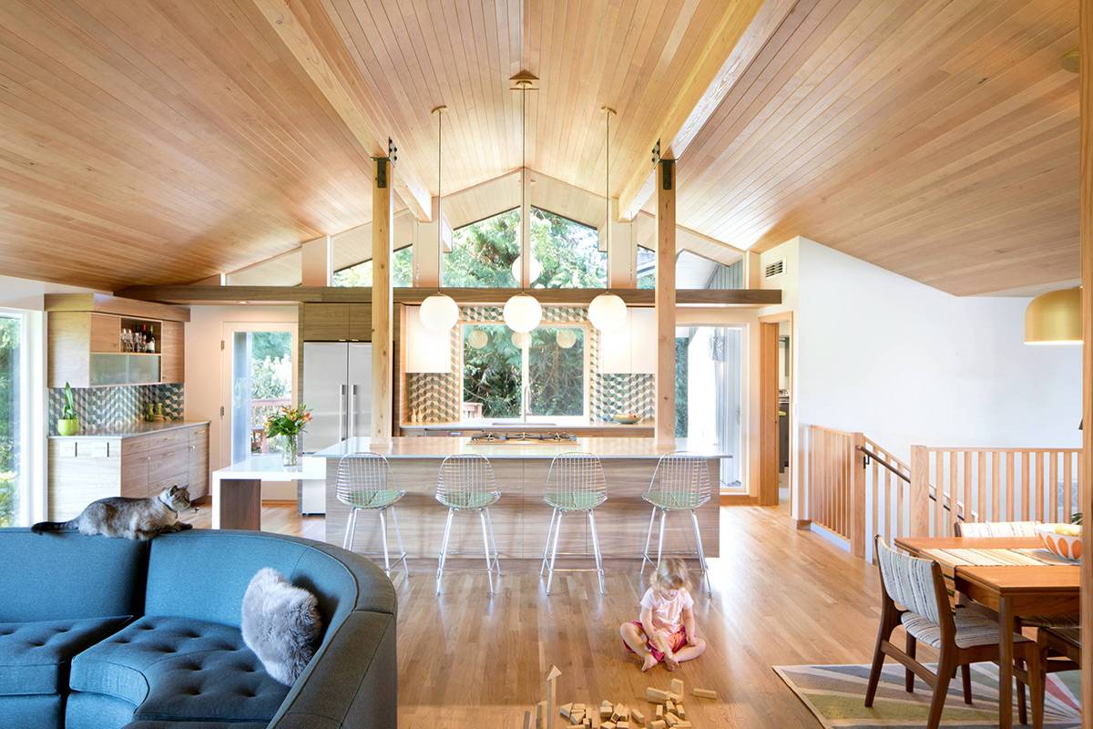 A ranch home mid-century kitchen that showcases an open concept and lots of natural wood finishes.