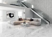 marble living room floor tiles with large comfy sectional in the middle. open floor plan with minimalist design