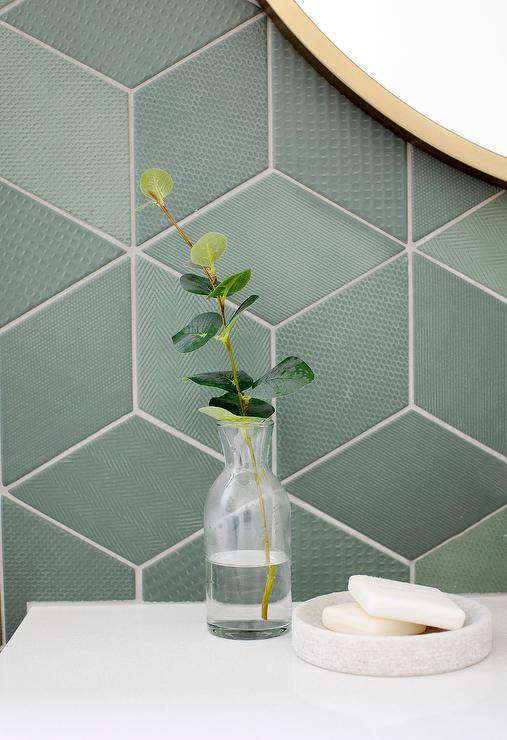 Stunning contemporary boasts walls covered in green geometric tiles.