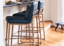 Kitchen features navy blue leather and rope stools at a blue and gray tiled bar.