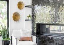 Living room features a modern fireplace with black glazed grid tiles and a white accent chair.
