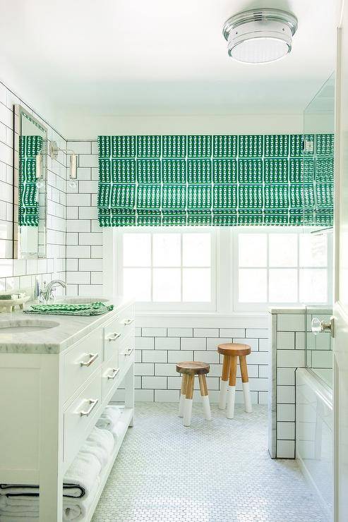 white and green bathroom with hex tile floor and subway tile walls, vibrant green roman shades over large windows