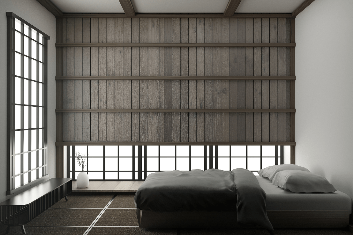 dark japanese style bedroom with low bed and wood blinds